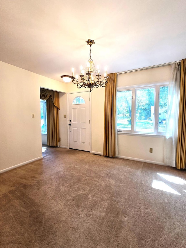 31 Whittier Blvd, Poughkeepsie, NY 12603 - empty room with a chandelier, carpet floors, and baseboards