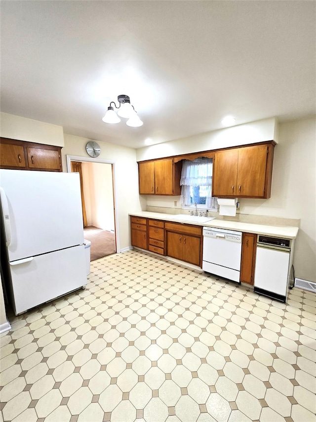 31 Whittier Blvd, Poughkeepsie, NY 12603 - kitchen featuring white appliances, light countertops, baseboards, and light floors