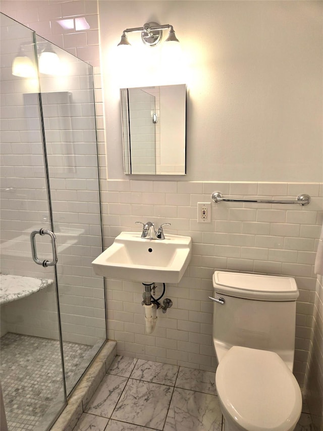 31 Whittier Blvd, Poughkeepsie, NY 12603 - full bath with marble look tiles, a stall shower, toilet, wainscoting, and a sink