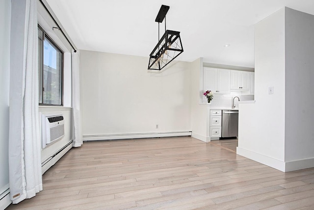 107 N Broadway Unit 201, White Plains, NY 10603 - unfurnished dining area featuring a baseboard radiator, baseboard heating, a wall mounted AC, light wood-type flooring, and recessed lighting