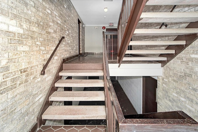 107 N Broadway Unit 201, White Plains, NY 10603 - stairway featuring brick wall and tile patterned floors