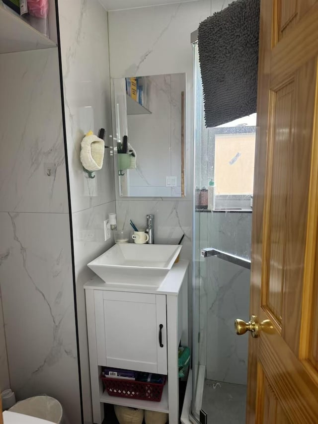 58-16 185th St, Fresh Meadows, NY 11365 - full bath with a marble finish shower, vanity, and tile walls