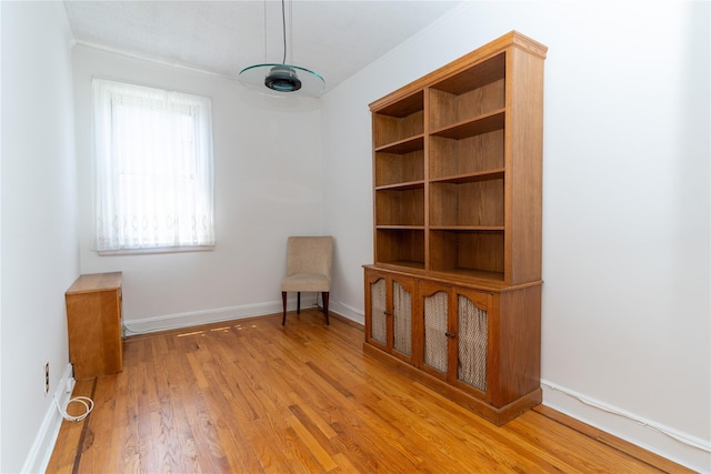 28-06 34th Ave, Astoria, NY 11106 - unfurnished room with wood finished floors, baseboards, and ornamental molding