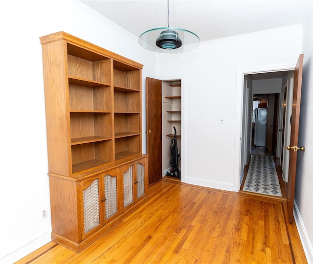 28-06 34th Ave, Astoria, NY 11106 - unfurnished room featuring ornamental molding, light wood finished floors, and baseboards