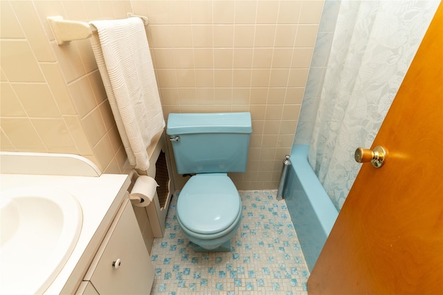 28-06 34th Ave, Astoria, NY 11106 - bathroom with toilet, tile patterned flooring, tile walls, vanity, and shower / bath combo