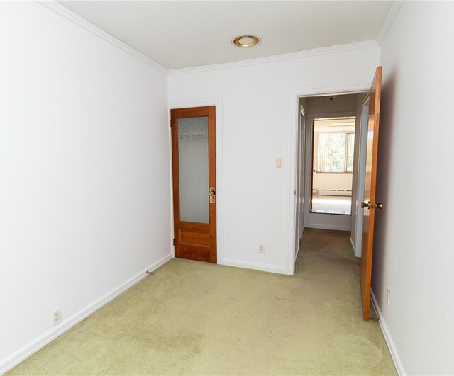 28-06 34th Ave, Astoria, NY 11106 - unfurnished bedroom with ornamental molding, light colored carpet, baseboards, and baseboard heating