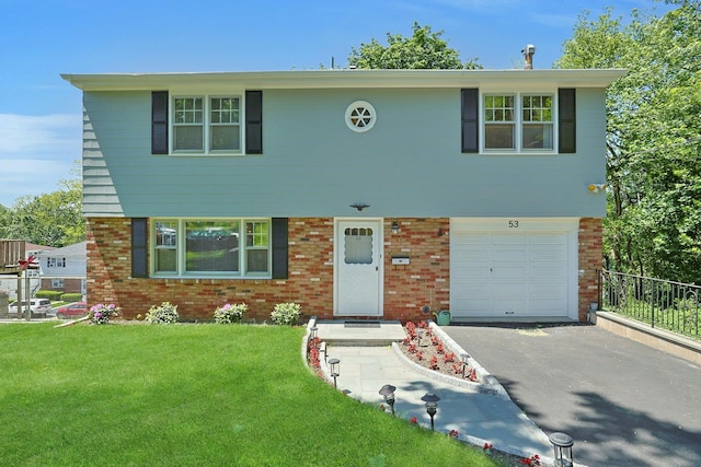 53 Prior Pl, Yonkers, NY 10710 - view of front facade with an attached garage, brick siding, and asphalt driveway