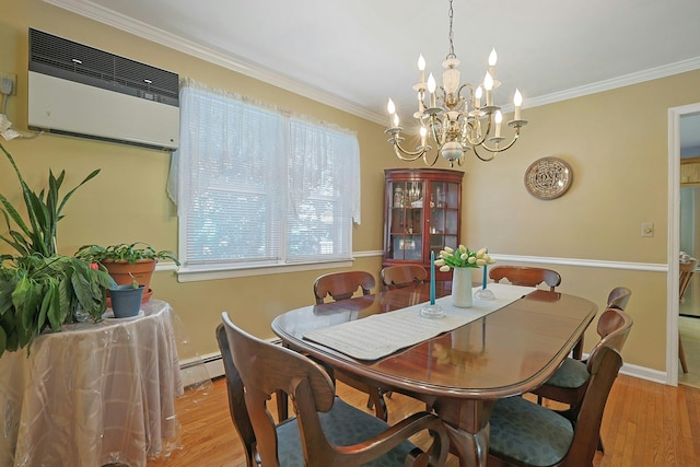 53 Prior Pl, Yonkers, NY 10710 - dining room featuring a chandelier, wood finished floors, an AC wall unit, crown molding, and baseboards