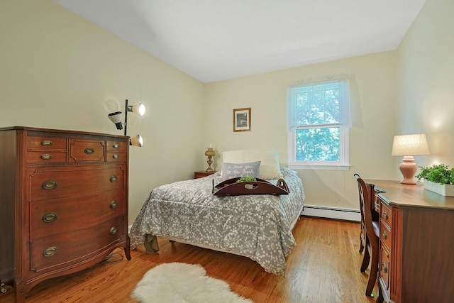 53 Prior Pl, Yonkers, NY 10710 - bedroom with a baseboard radiator and light wood-style floors
