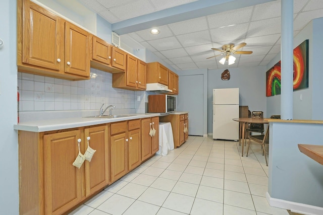 53 Prior Pl, Yonkers, NY 10710 - kitchen featuring freestanding refrigerator, a drop ceiling, a sink, a ceiling fan, and light countertops