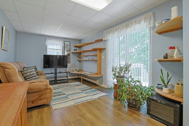 53 Prior Pl, Yonkers, NY 10710 - living area featuring wood finished floors and a paneled ceiling