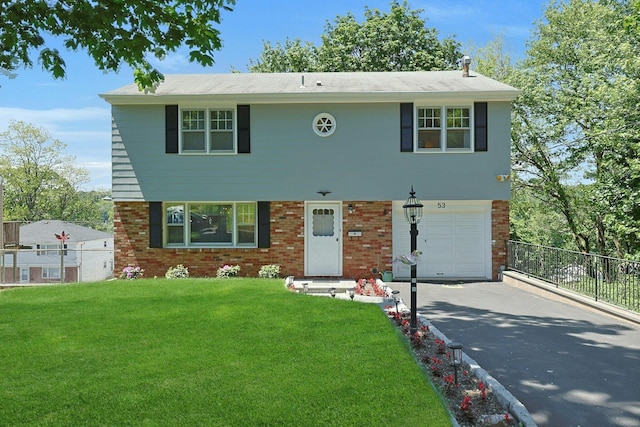 53 Prior Pl, Yonkers, NY 10710 - view of front of property featuring asphalt driveway, an attached garage, and brick siding