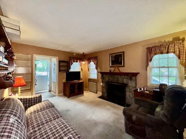 76 Albermarle Ave, Valley Stream, NY 11580 - carpeted living area with a fireplace and radiator heating unit