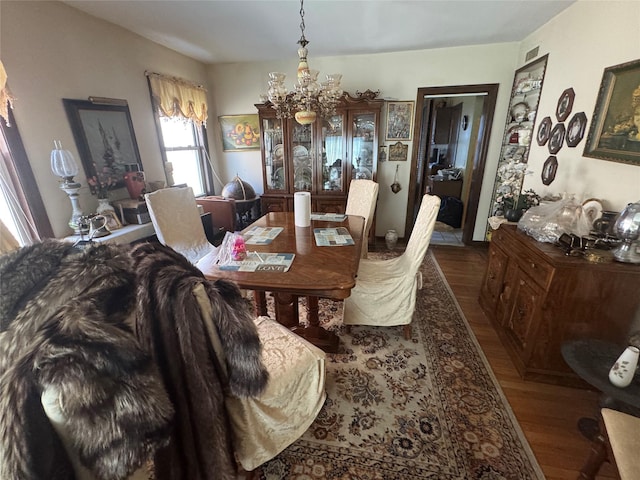 5307 65th Pl, Maspeth, NY 11378 - dining area featuring a chandelier and dark wood-style flooring