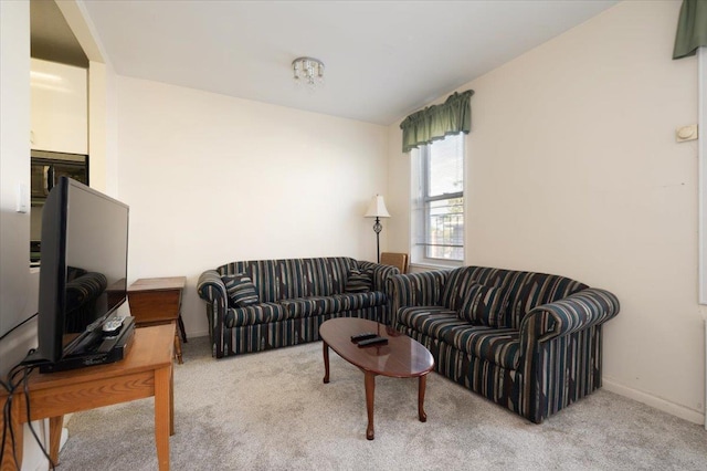 16 Main St Unit 3Y, East Rockaway, NY 11518 - carpeted living room featuring baseboards