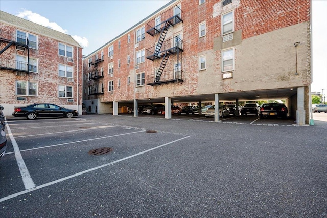16 Main St Unit 3Y, East Rockaway, NY 11518 - view of apartment building / complex featuring covered parking