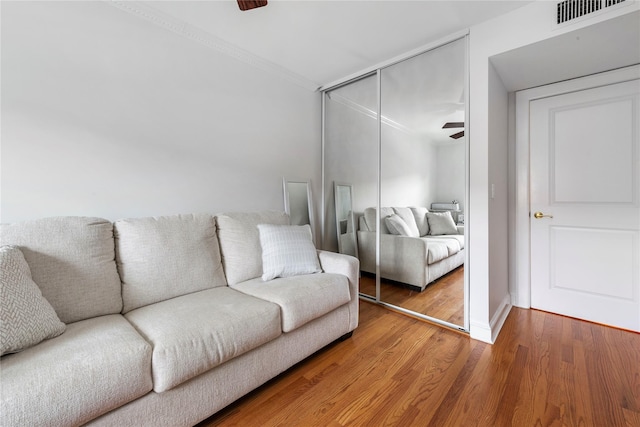 1229 Estates Ln Triplex, Unit Triplex, Bayside, NY 11360 - living room featuring wood finished floors, a ceiling fan, crown molding, and baseboards
