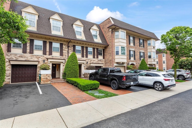 1229 Estates Ln Triplex, Unit Triplex, Bayside, NY 11360 - townhome / multi-family property featuring a shingled roof and brick siding