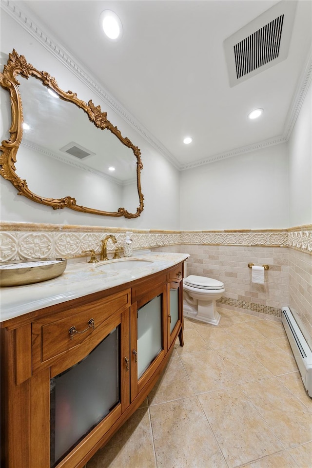 1229 Estates Ln Triplex, Unit Triplex, Bayside, NY 11360 - bathroom featuring tile walls, wainscoting, vanity, baseboard heating, and toilet