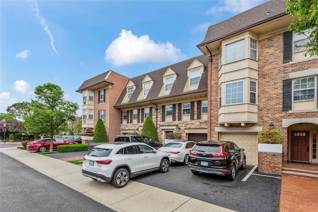 1229 Estates Ln Triplex, Unit Triplex, Bayside, NY 11360 - multi unit property with a shingled roof, a garage, brick siding, and driveway