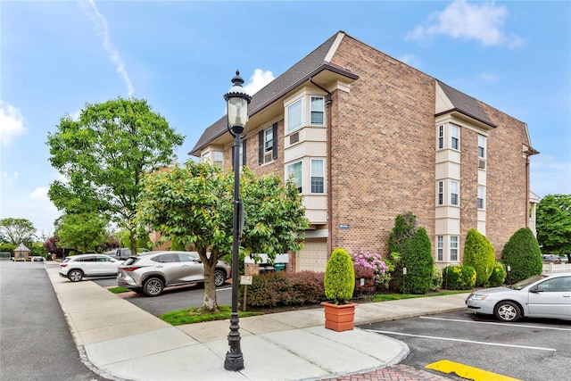 1229 Estates Ln Triplex, Unit Triplex, Bayside, NY 11360 - view of property featuring uncovered parking