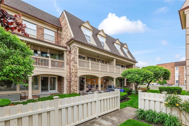 1229 Estates Ln Triplex, Unit Triplex, Bayside, NY 11360 - back of house with a shingled roof, a balcony, and brick siding