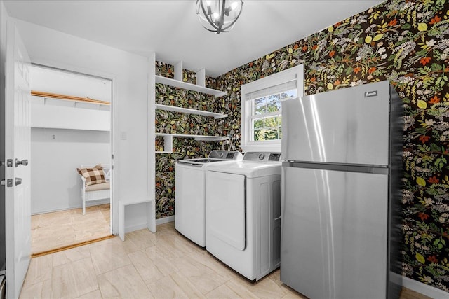 18 Stirrup Ln, Glen Cove, NY 11542 - laundry room with wallpapered walls, washer and dryer, and baseboards