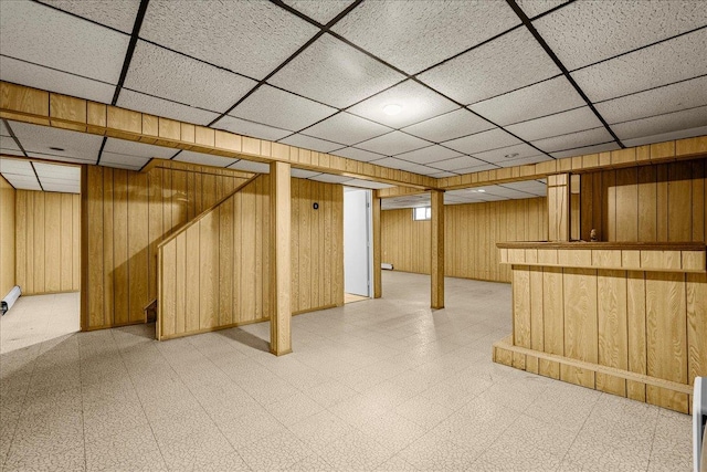 18 Stirrup Ln, Glen Cove, NY 11542 - finished below grade area with light floors, wood walls, and a drop ceiling
