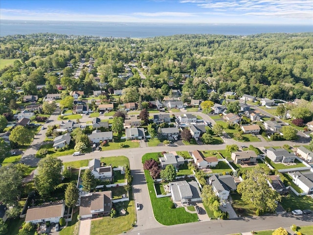 18 Stirrup Ln, Glen Cove, NY 11542 - aerial overview of property's location with nearby suburban area, a heavily wooded area, and a large body of water