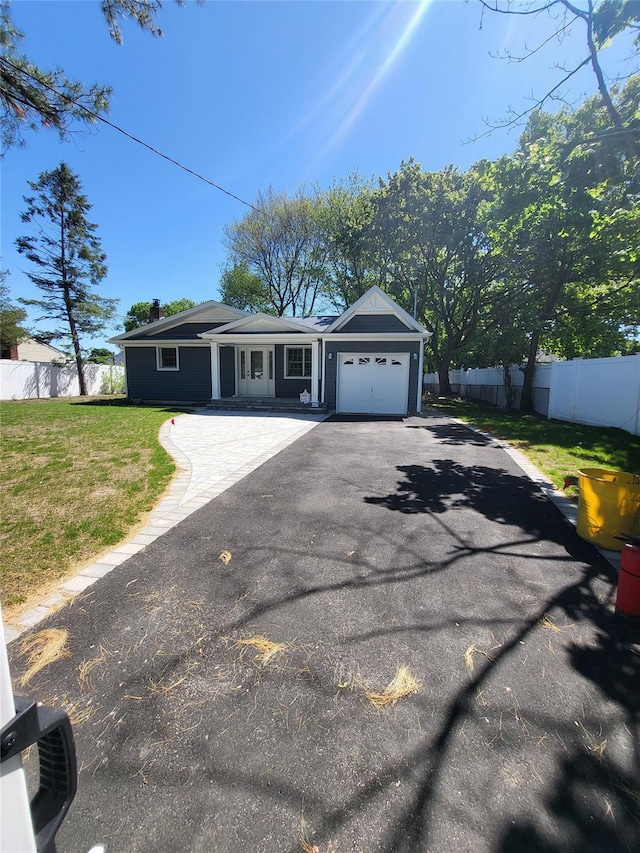 1017 Fire Island Ave, Bay Shore, NY 11706 - ranch-style home with asphalt driveway, a garage, and a chimney