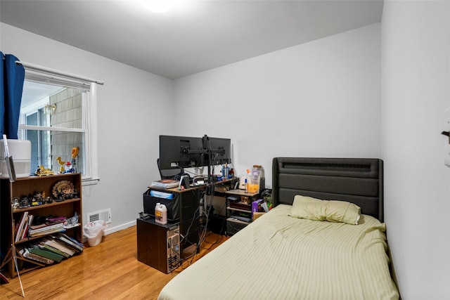 11 Parsons St, Harrison, NY 10528 - bedroom with wood finished floors, baseboards, and an office area