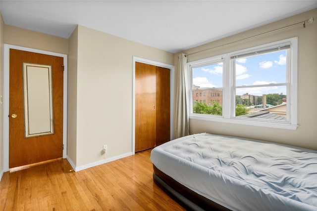 11 Parsons St, Harrison, NY 10528 - bedroom featuring baseboards, a closet, and light wood-type flooring
