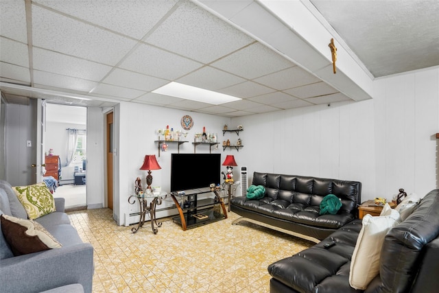 11 Parsons St, Harrison, NY 10528 - living area with tile patterned floors and a paneled ceiling
