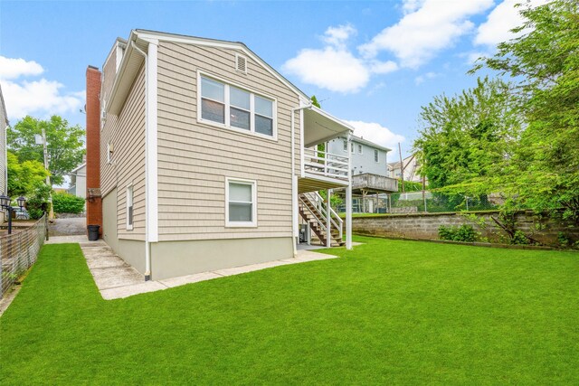 11 Parsons St, Harrison, NY 10528 - back of property featuring stairway and a wooden deck