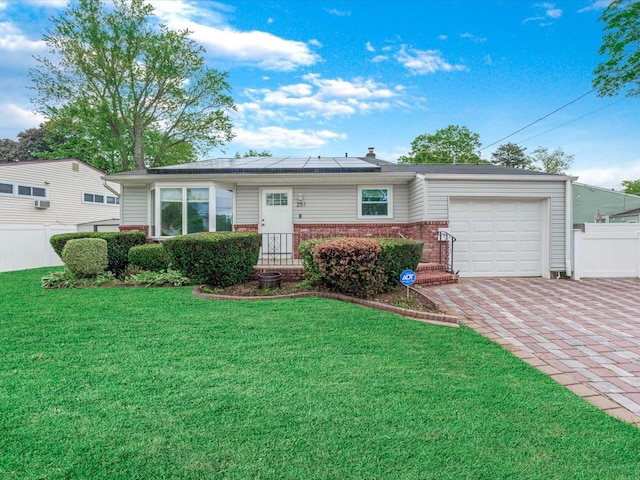 251 Woods Rd, North Babylon, NY 11703 - ranch-style home featuring brick siding, a garage, solar panels, and decorative driveway