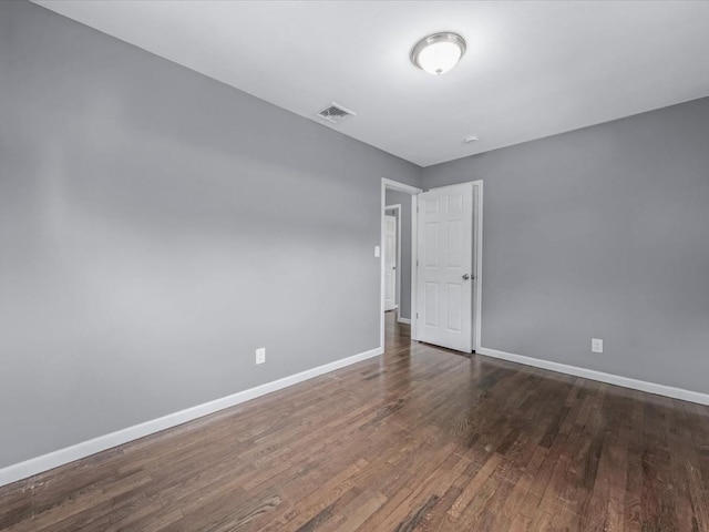 251 Woods Rd, North Babylon, NY 11703 - empty room with baseboards and wood finished floors