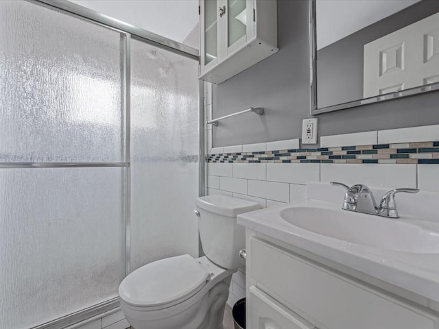 251 Woods Rd, North Babylon, NY 11703 - full bath with tile walls, vanity, a stall shower, and toilet