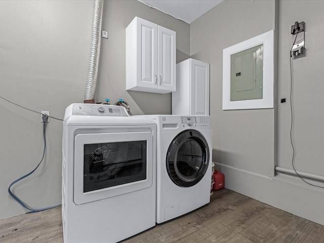 251 Woods Rd, North Babylon, NY 11703 - laundry room with cabinet space, electric panel, separate washer and dryer, and light wood finished floors