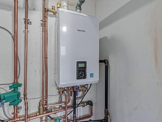 251 Woods Rd, North Babylon, NY 11703 - utility room with tankless water heater