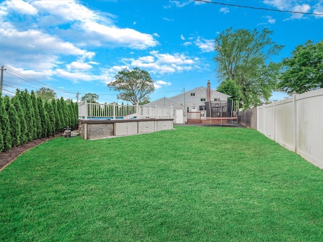 251 Woods Rd, North Babylon, NY 11703 - view of yard with a trampoline and an outdoor pool