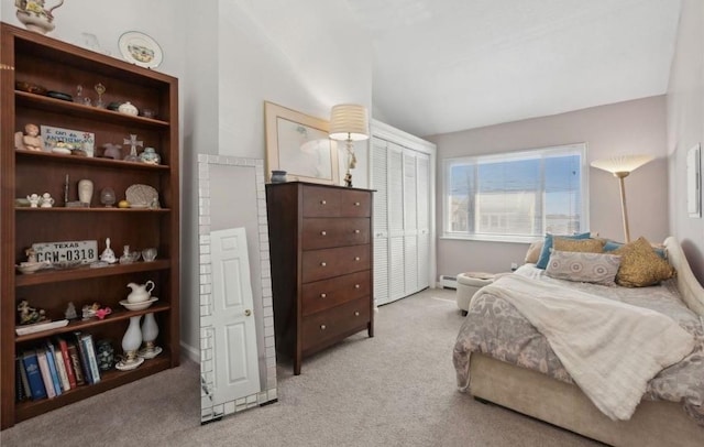 56 Yacht Club Rd, Babylon, NY 11702 - bedroom with lofted ceiling, light colored carpet, a closet, and a baseboard heating unit