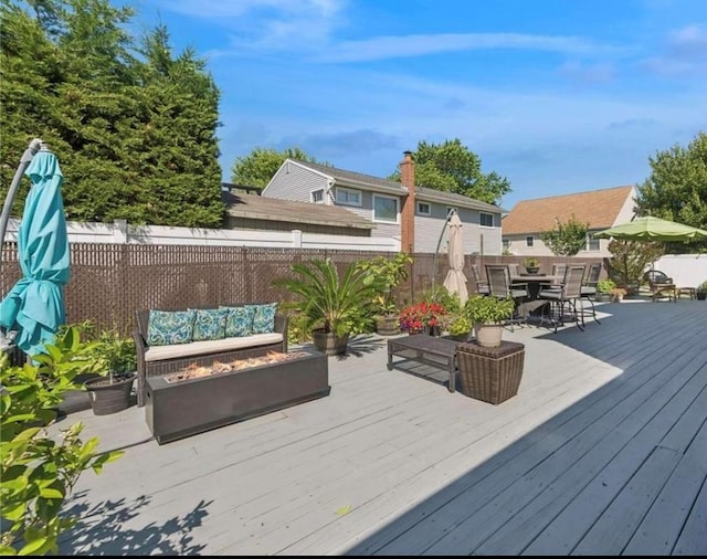 56 Yacht Club Rd, Babylon, NY 11702 - deck with outdoor lounge area, a fenced backyard, and outdoor dining area