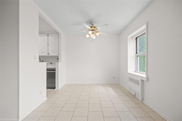 415 Gramatan Ave Unit 2C, Mount Vernon, NY 10552 - empty room with radiator heating unit, ceiling fan, light tile patterned floors, and baseboards