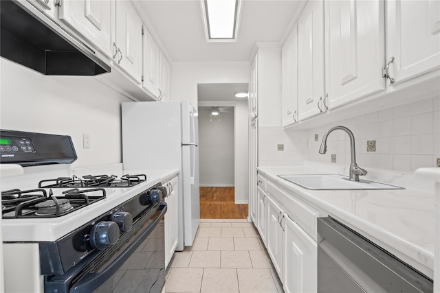 415 Gramatan Ave Unit 2C, Mount Vernon, NY 10552 - kitchen featuring gas range oven, exhaust hood, stainless steel dishwasher, a sink, and white cabinets