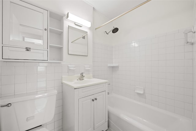 415 Gramatan Ave Unit 2C, Mount Vernon, NY 10552 - bathroom featuring tile walls, washtub / shower combination, toilet, and vanity