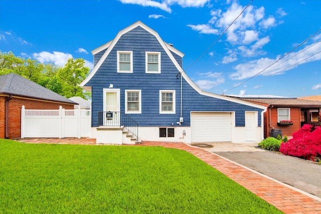 211 Bowne St, Bronx, NY 10464 - back of house featuring driveway and an attached garage