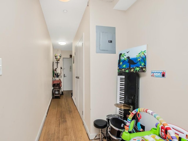 1347 Bristow St Unit 4B, Bronx, NY 10459 - hall with electric panel, light wood finished floors, and baseboards