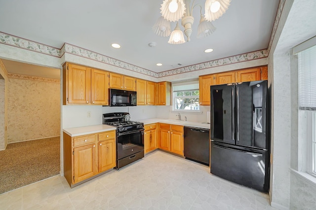 192 Theodore Dr, Coram, NY 11727 - kitchen featuring black appliances, a chandelier, a sink, light countertops, and recessed lighting