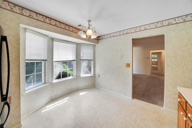 192 Theodore Dr, Coram, NY 11727 - unfurnished dining area with plenty of natural light, a chandelier, and wallpapered walls
