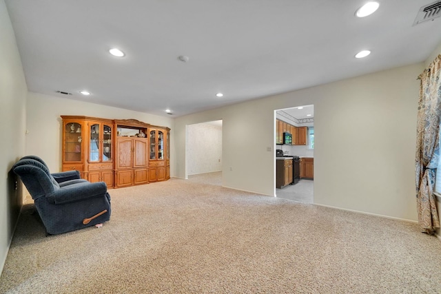 192 Theodore Dr, Coram, NY 11727 - sitting room with light colored carpet, recessed lighting, and baseboards